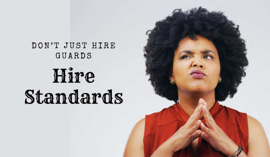 Concerned woman thinking critically with the text "Don't Just Hire Guards — Hire Standards," representing key considerations when choosing a security service.